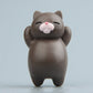 Dark brown cartoon cat resin fridge magnet, standing figure with pink nose and closed eyes.