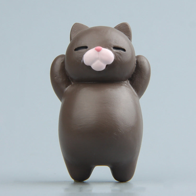 Dark brown cartoon cat resin fridge magnet, standing figure with pink nose and closed eyes.
