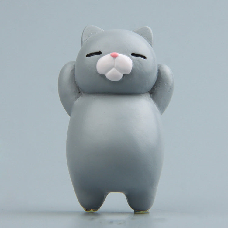 Light gray cartoon cat resin fridge magnet, standing figure with pink nose and closed eyes.