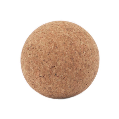 Cork massage ball for fascia massage, tan textured surface.