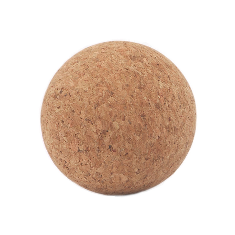Tan cork fascia massage ball, rounded shape with textured finish.