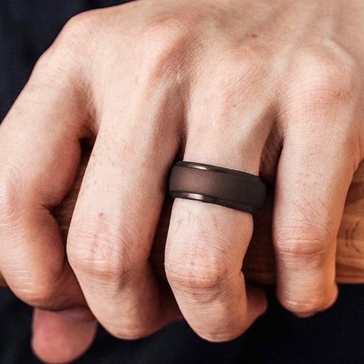 8mm wide curved silicone step ring, black/dark gray, worn on finger