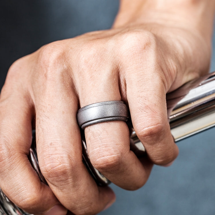 8mm wide curved silicone step ring, dark gray, worn on finger