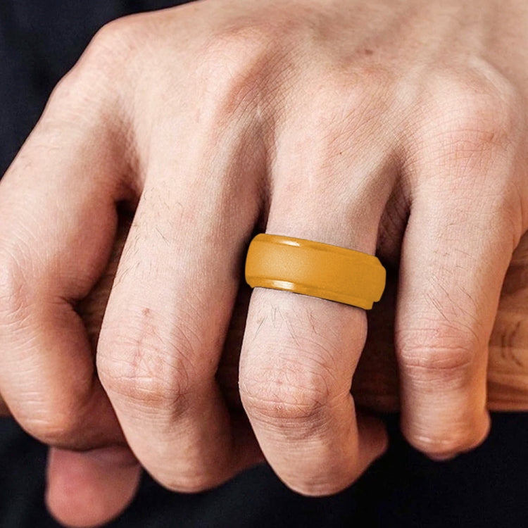 Gold 8mm curved step silicone ring on finger, wide band with raised edge