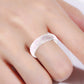 Glitter silicone ring, wide band, pink speckled design on finger