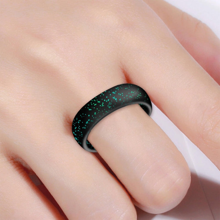 Wide black silicone ring with green glitter scattered pattern