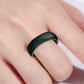 Black silicone glitter ring with green flashes, worn on finger