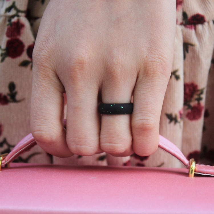 Black glitter silicone ring band on finger