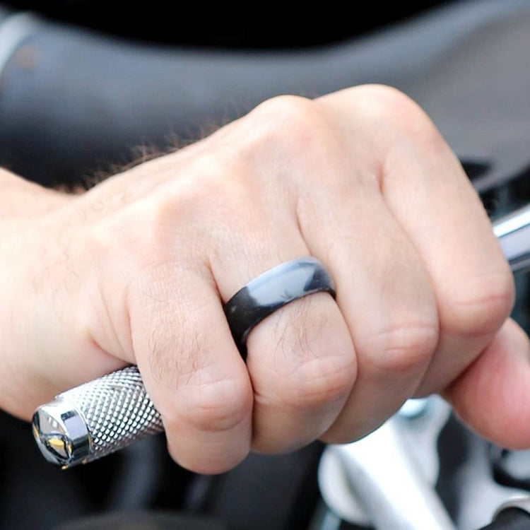 Curved silicone sports ring, dark gray band on finger