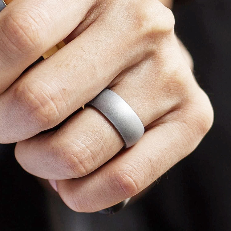 Curved silicone sports ring, light gray matte finish on finger