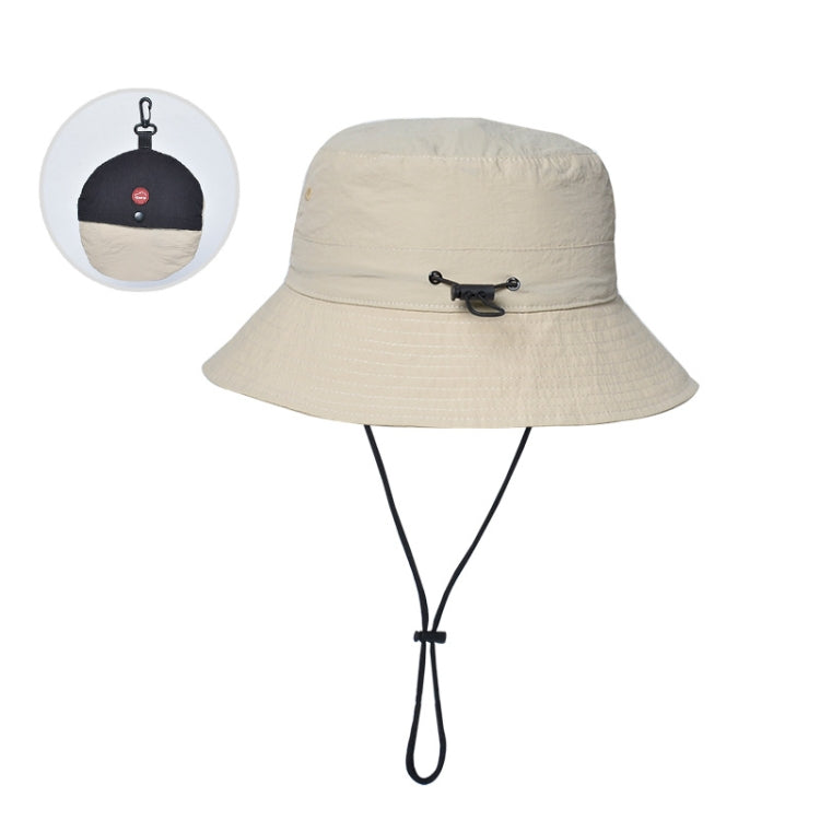 Beige foldable bucket sun hat with chin strap and black toggle cord