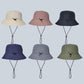 Assorted color foldable bucket sun hats with chin straps and black toggle cords
