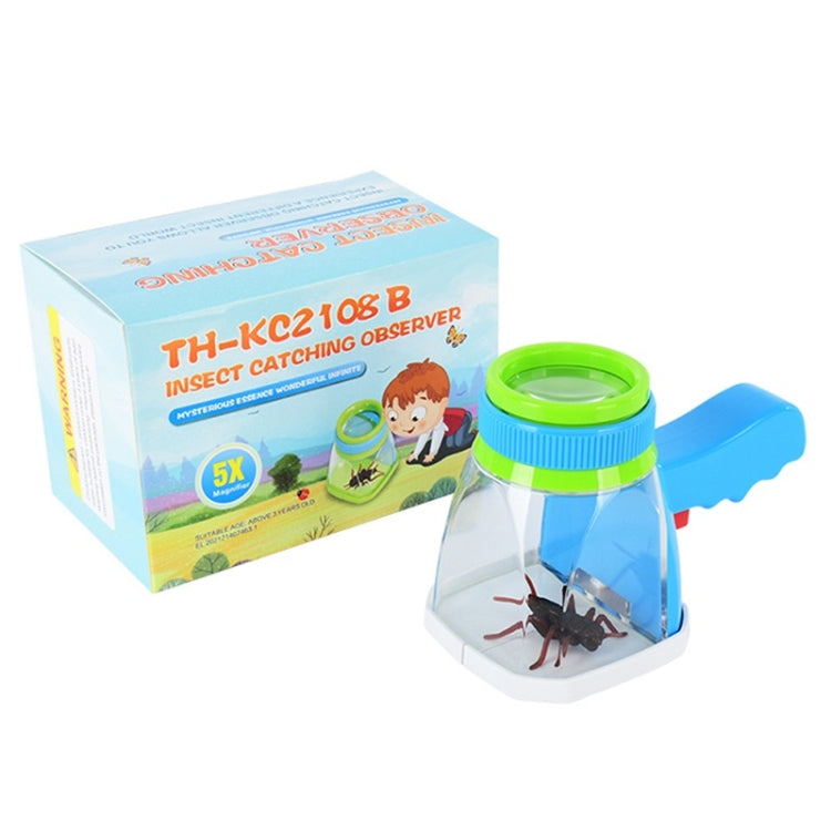 Magnifying insect viewer with blue-green chamber beside labeled science kit box