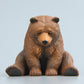 Sitting brown bear fridge magnet figure with closed eyes and dark nose