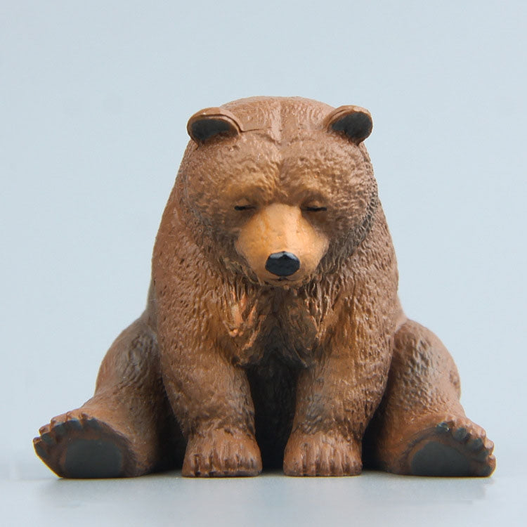 Sitting brown bear fridge magnet figure with closed eyes and dark nose