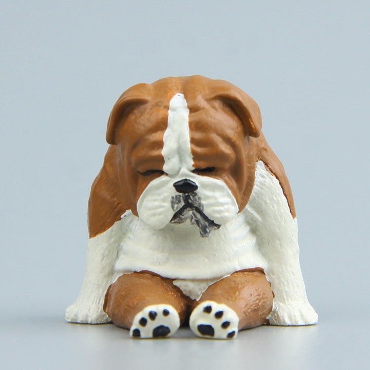 Sitting tan-and-white pug dog fridge magnet figure with black nose and closed eyes