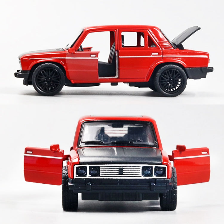 Red die-cast alloy car model toy with open door, shown from side and front