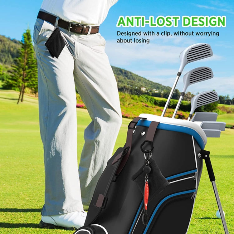 Black golf ball cleaning towel clipped to a golf bag for easy access