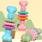 Assorted bone-shaped dog teething chew toys in blue, pink, purple, green, and orange