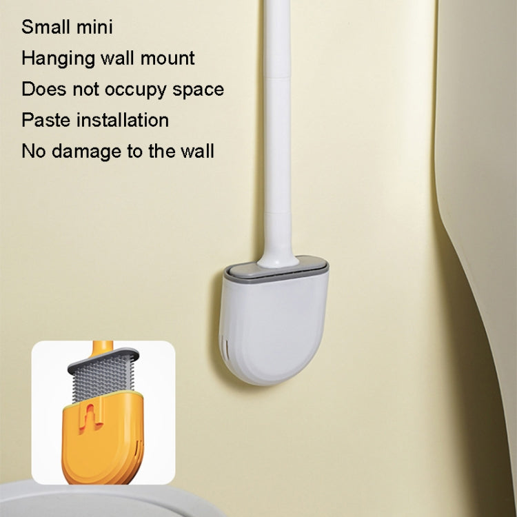 Wall-mounted toilet brush with white handle and gray soft U-shaped rubber head