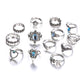 Set of 13 silver-tone rings with blue gemstone settings, assorted styles