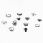 Set of open rings with assorted gothic charms, including cross, butterfly, dice, and spider