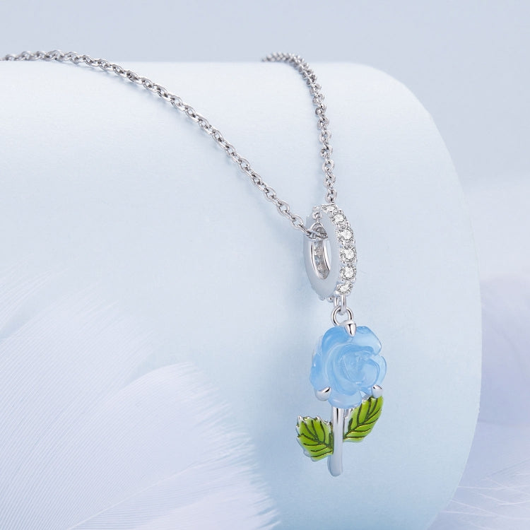 Sterling silver necklace with blue color-changing rose charm and green enamel leaves