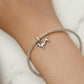 Sterling silver dachshund charm bracelet on wrist with mesh chain