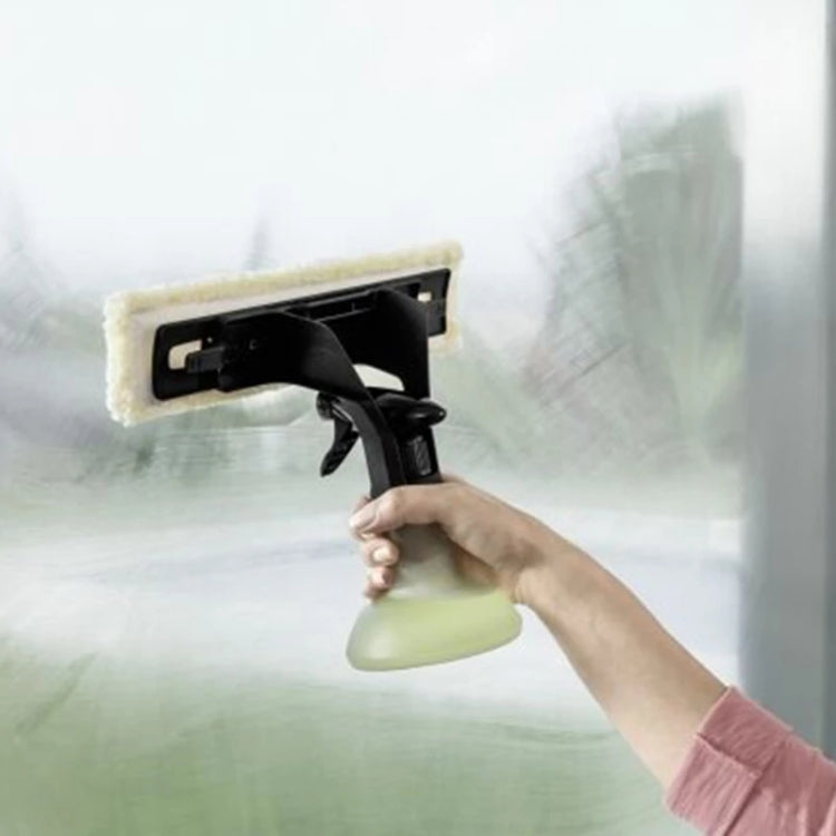 Window spray bottle with yellow microfiber cleaning pad attached