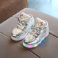 Kids flashing light sneakers, silver metallic with star applique and multicolor glowing sole