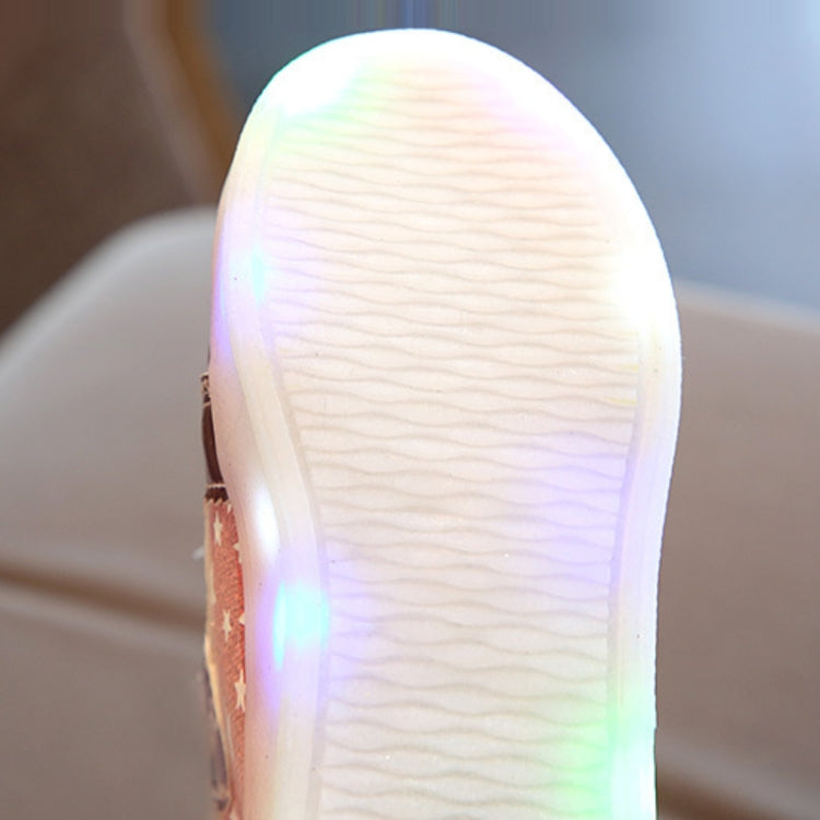 Kids sneaker outsole close-up with multicolor LED glow along the bottom edge