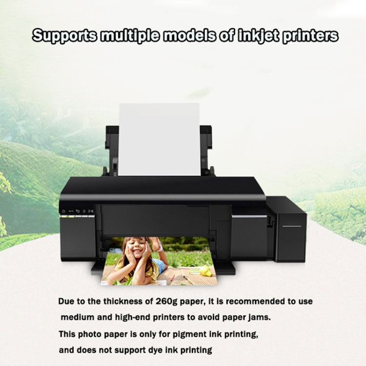 Waterproof inkjet photo paper sheet in printer tray with glossy white finish