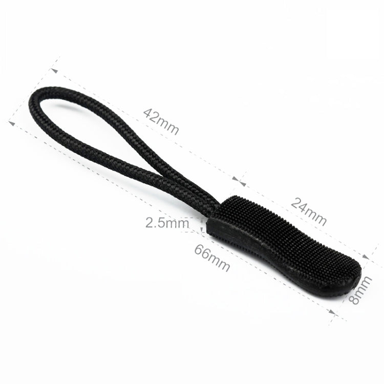 Black zipper cord puller with textured plastic slider tip and looped strap
