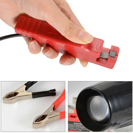 Red spark-plug sensor clip held in hand with attached black lead