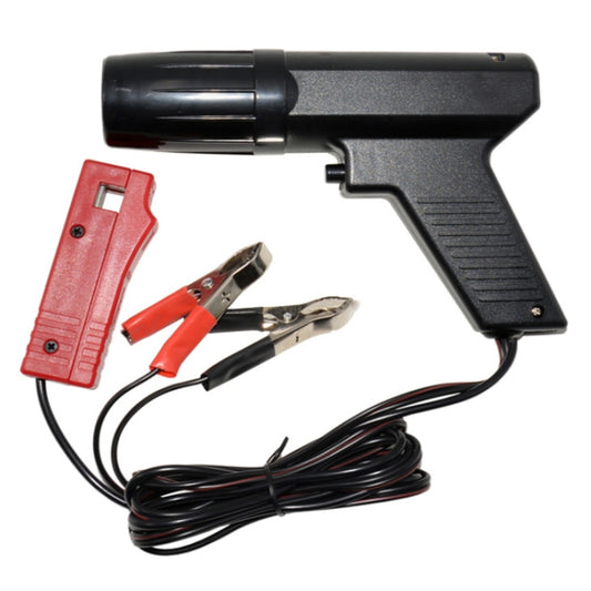 Gun-type timing light with black body, red connector, and black wire test leads