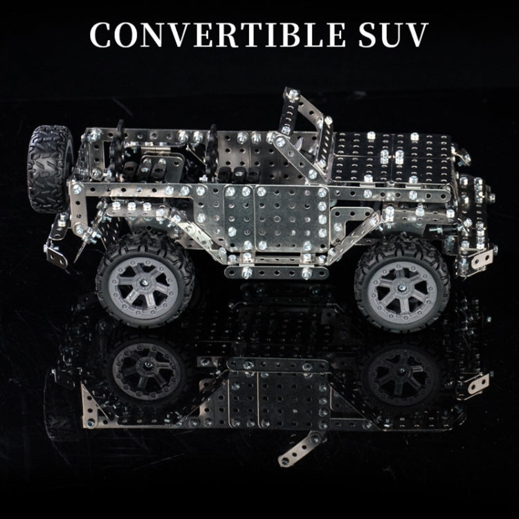 Metal off-road vehicle model toy with silver plate body and black wheels, full side profile view