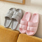 Gray and pink EVA slide slippers, cushioned crossover straps with ribbed insole