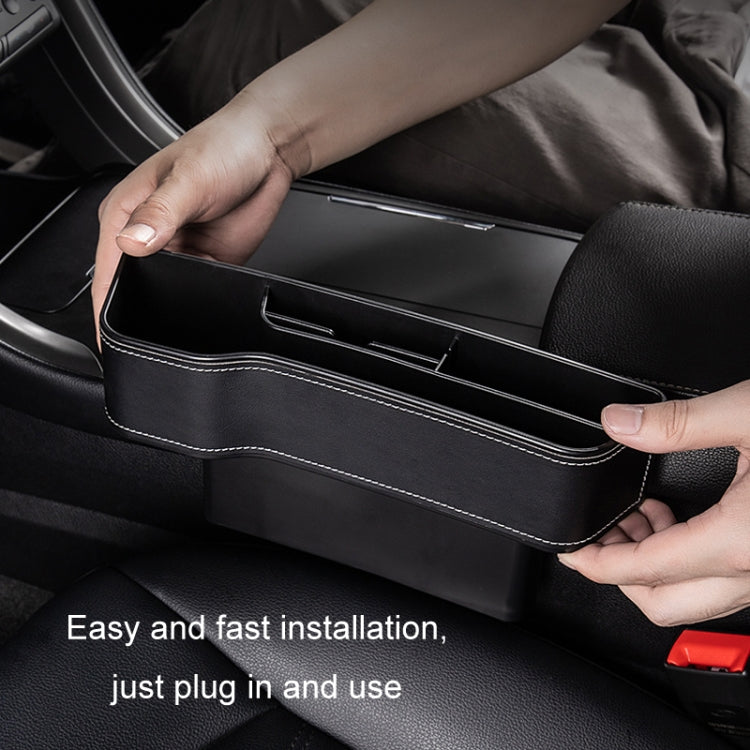 Black leather-look seat crevice storage box held in place between seats