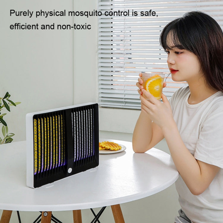 Compact black mosquito killer lamp with dual UV grids, glowing yellow and purple