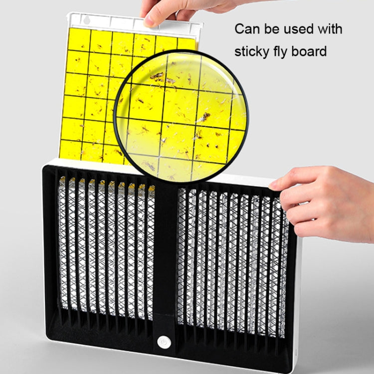Mosquito killer lamp with yellow sticky fly board placed on top, showing grid coverage