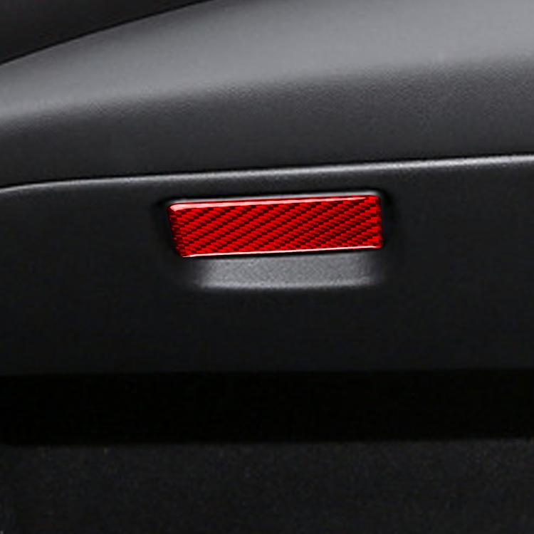 Red carbon-fiber storage box sticker installed on dashboard surface