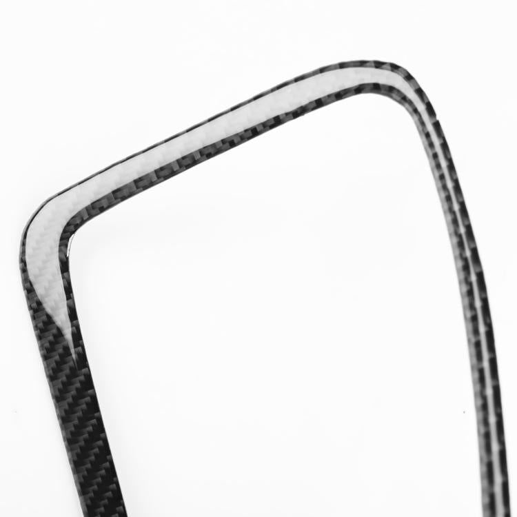Close-up of black carbon-fiber reading light frame trim sticker, rounded rectangle