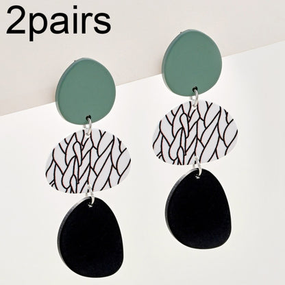 Long dangle earrings with teal round tops and black patterned oval drops