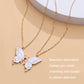 Goldtone butterfly pendant necklace with white enamel butterfly charms and small chain links