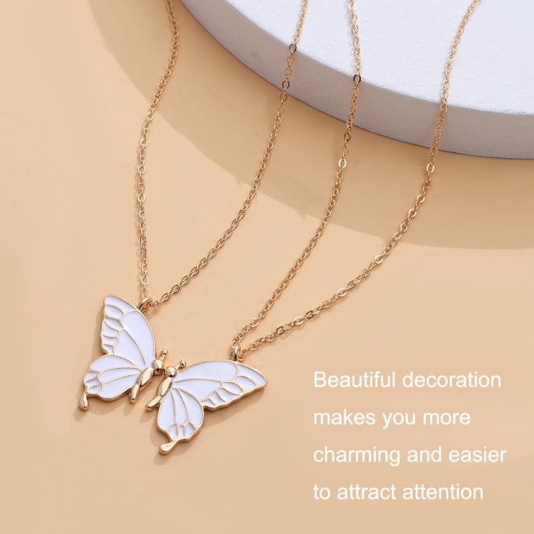 Goldtone butterfly pendant necklace with white enamel butterfly charms and small chain links