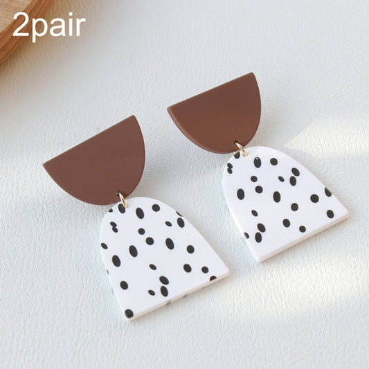 Acrylic clay dangle earrings, two pairs: white with black dots and brown caps
