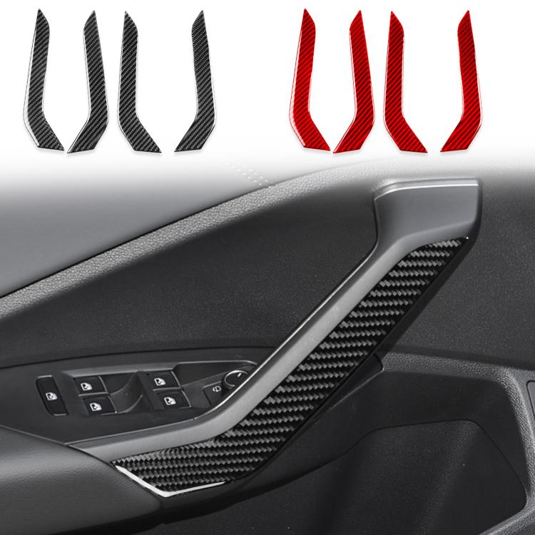 Black carbon-fiber style door armrest decorative stickers installed on car interior panel.
