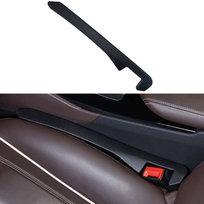 Black car seat gap filler strip with red latch for console gap.