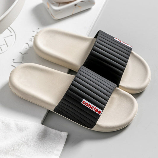 Men's and women's black slide slippers with ribbed strap and cushioned light sole