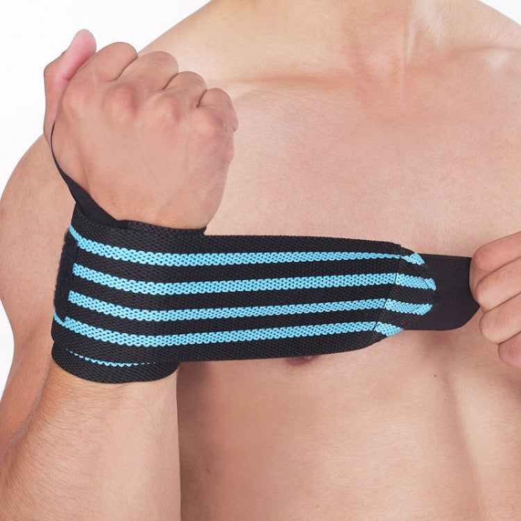 Black weightlifting wrist wrap with light blue striped band on a clenched fist